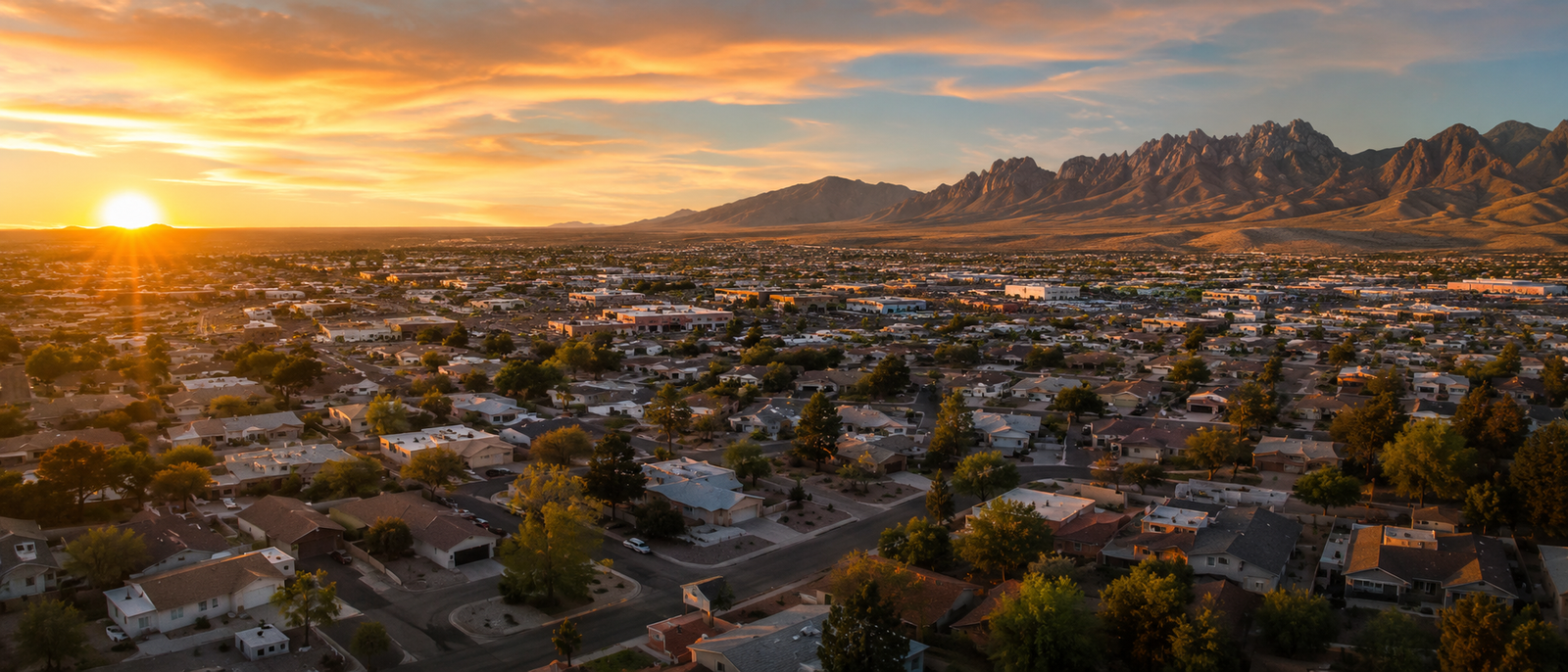 Las Cruces New Mexico rooftops with Organ Mountains at sunset